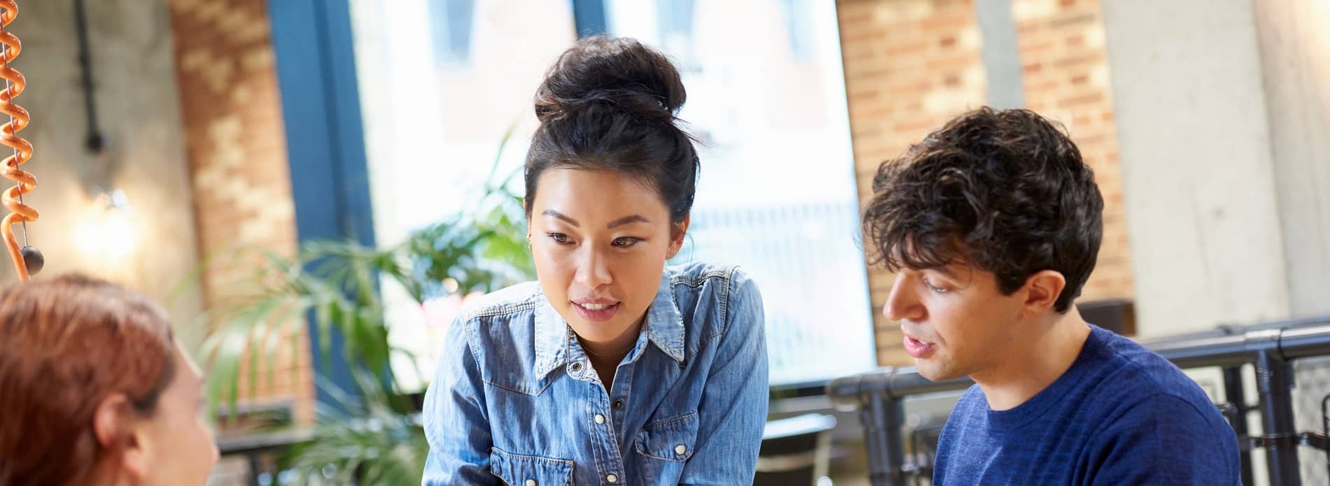 woman speaking to colleagues 