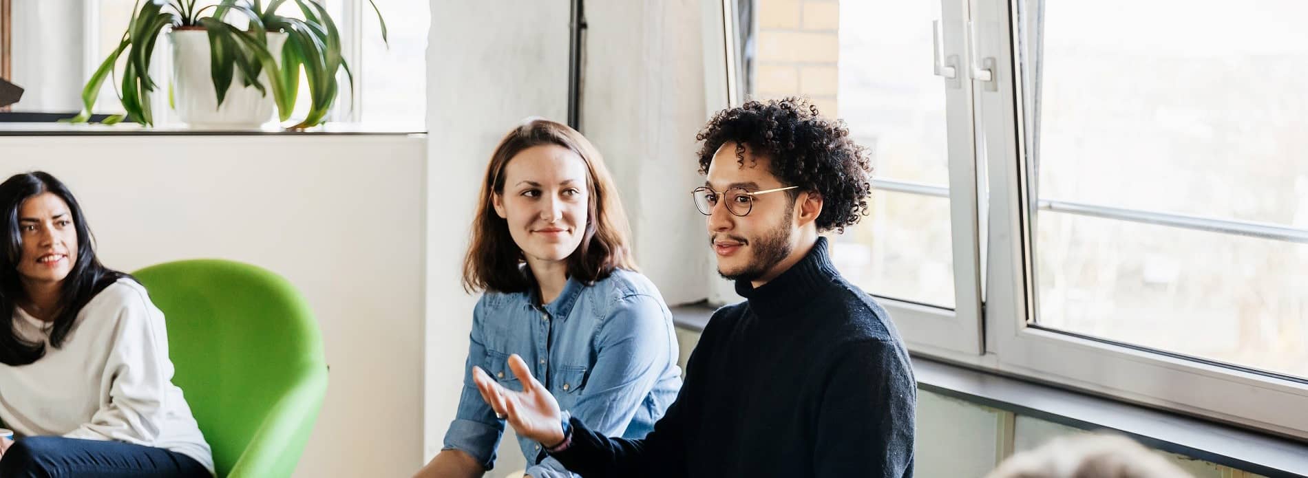 man talking in team meeting