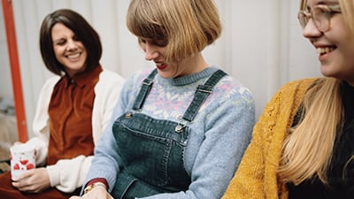 Three women smiling