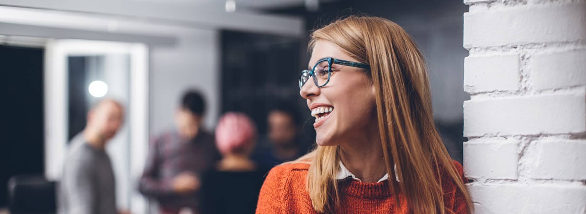 Woman laughing at work