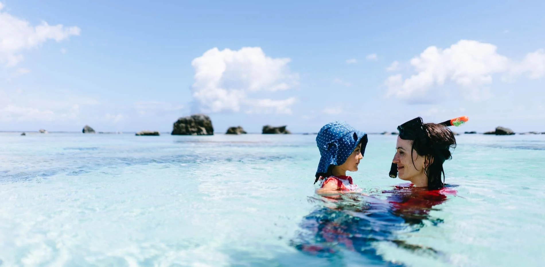 Mother and daughter swimming in the sea