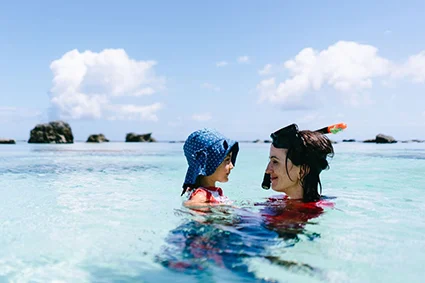 Mother and daughter swimming