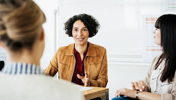 woman talking in a group work meeting